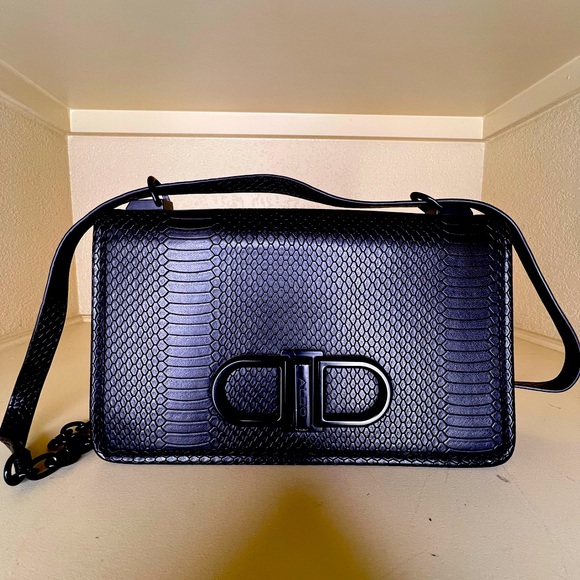 Aldo Handbags - Snake-like aesthetic makes this handbag design a standout among the crowd!